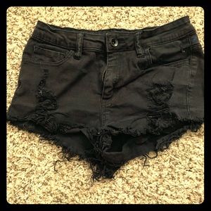 Black distressed shorts